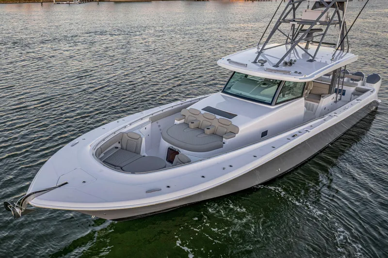  Yacht Photos Pics 2026 HCB 56 Suenos GIX luxury boat on calm water, showcasing sleek design and spacious deck.