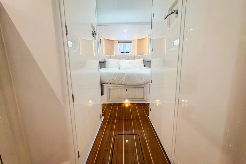  Yacht Photos Pics Luxurious cabin interior of 2026 HCB 56 Suenos GIX with elegant wood flooring.