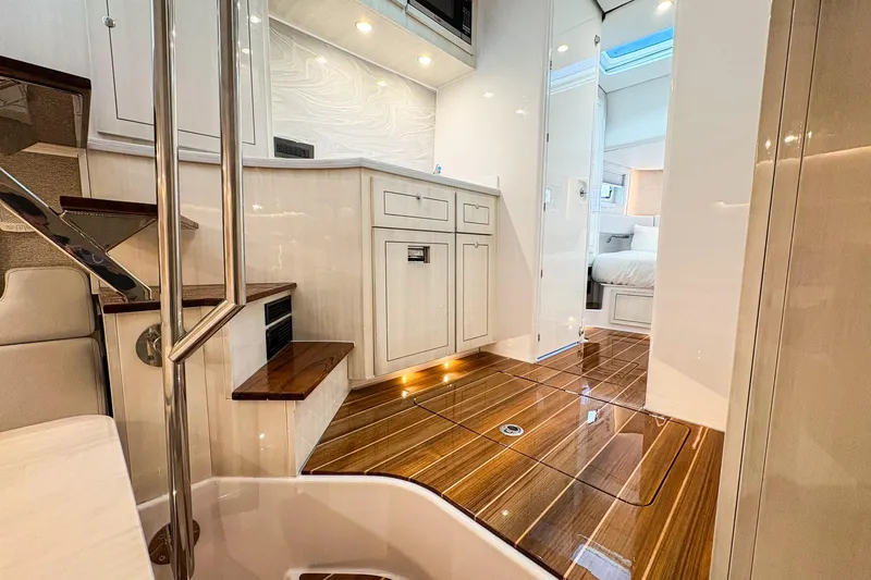  Yacht Photos Pics Luxurious interior of 2026 HCB 56 Suenos GIX yacht with elegant wood flooring.