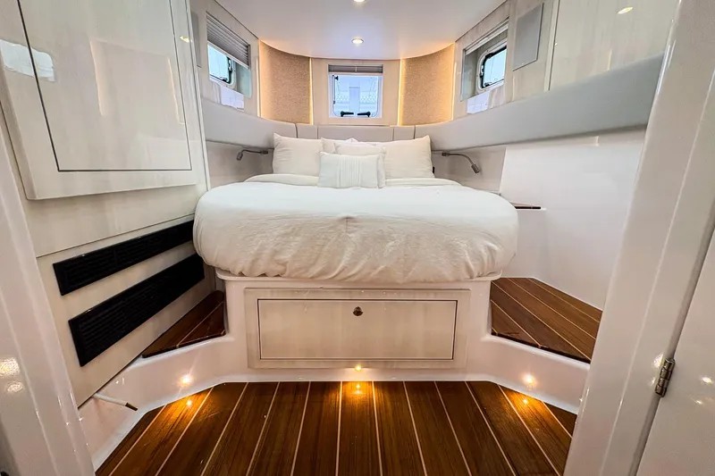  Yacht Photos Pics Luxurious cabin interior of 2026 HCB 56 Suenos GIX with elegant wood flooring.