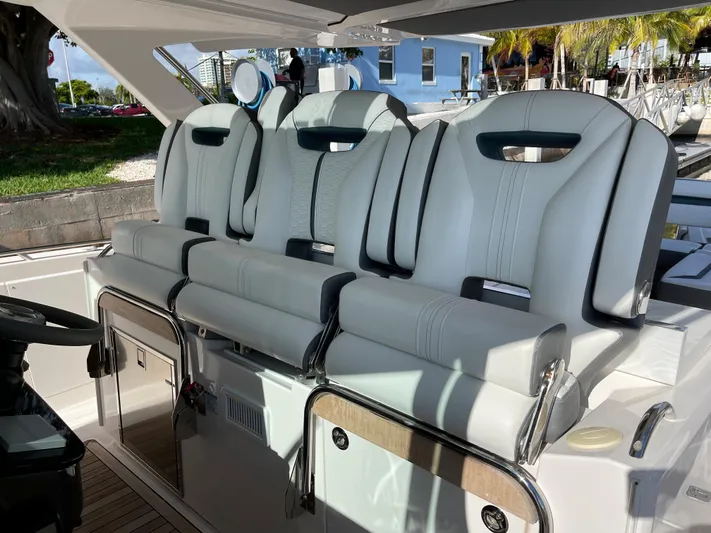  Yacht Photos Pics 2020 Tiara Yachts 38 LS luxury boat seating area with three white cushioned seats.