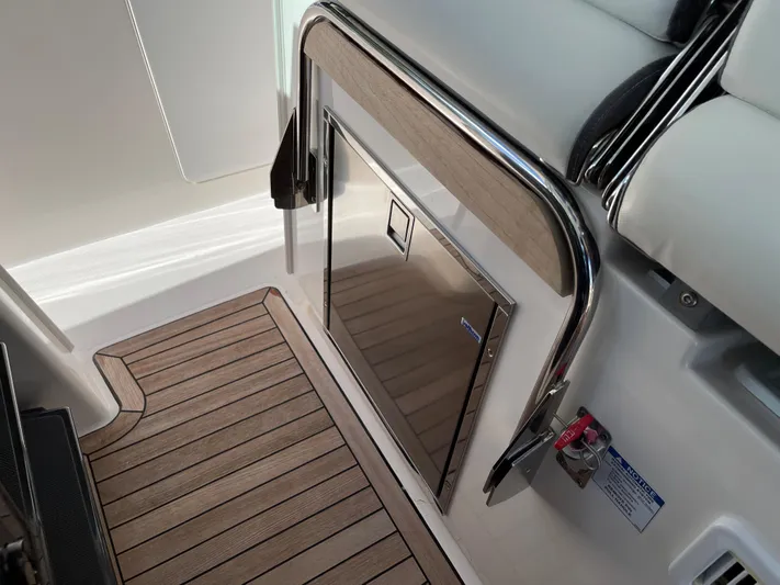  Yacht Photos Pics 2020 Tiara Yachts 38 LS interior with teak flooring and stainless steel accents.