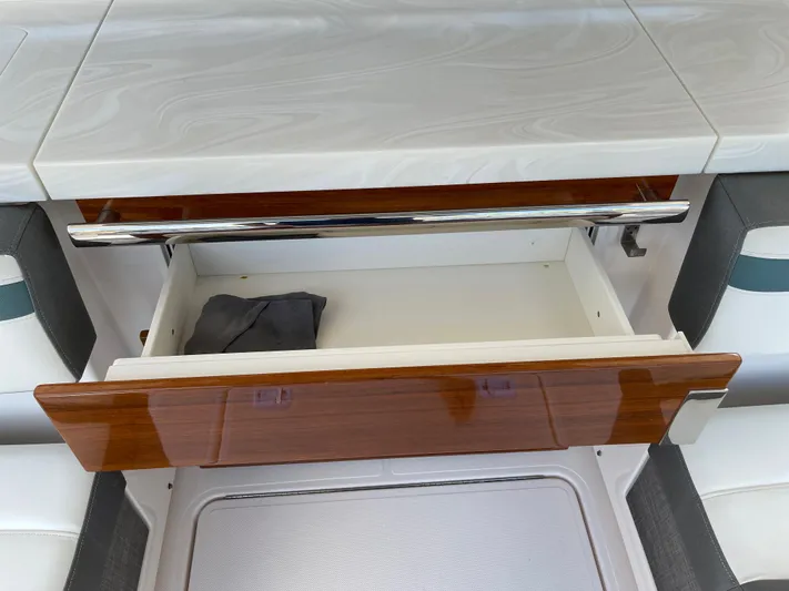 Yacht Photos Pics Open drawer on a 2020 Tiara Yachts 38 LS, showcasing interior storage space.