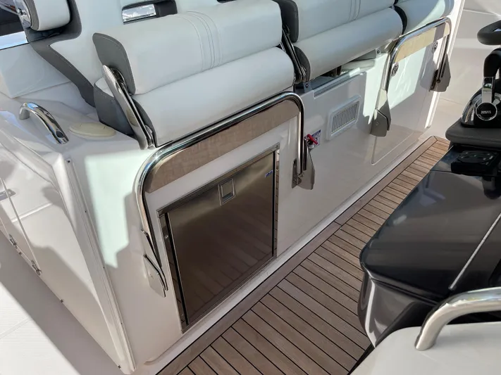  Yacht Photos Pics 2020 Tiara Yachts 38 LS interior with seating and mini fridge.