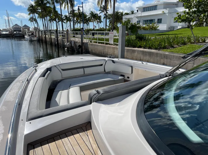  Yacht Photos Pics 2020 Tiara Yachts 38 LS docked, featuring spacious seating and luxurious design.