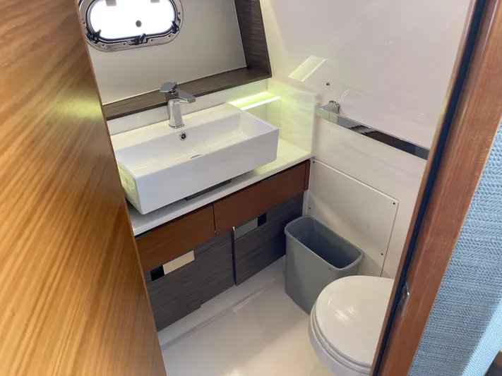  Yacht Photos Pics Modern bathroom in 2020 Tiara Yachts 38 LS with sink, toilet, and storage.
