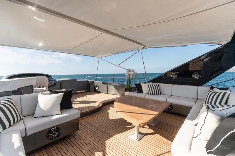 Spectre Yacht Photos Pics Luxurious 2004 Azimut 100 Jumbo yacht deck with elegant seating and ocean view.