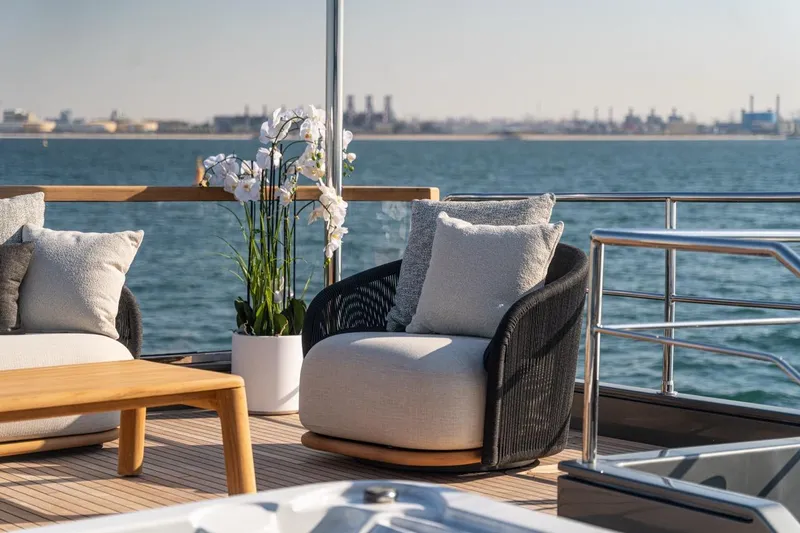 Spectre Yacht Photos Pics Luxurious deck seating on 2004 Azimut 100 Jumbo yacht with ocean view.