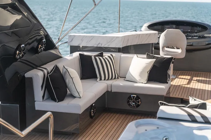 Spectre Yacht Photos Pics Luxurious seating area on 2004 Azimut 100 Jumbo yacht with ocean view.