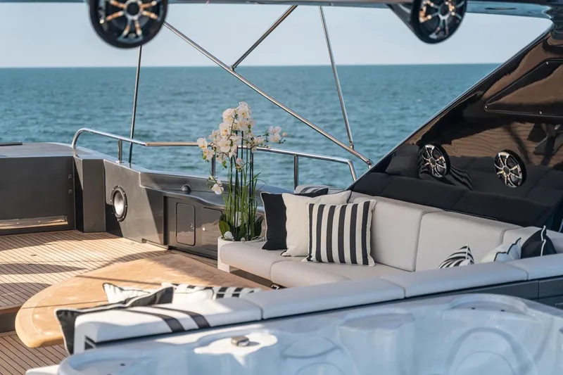 Spectre Yacht Photos Pics Luxurious Azimut 100 Jumbo yacht deck with elegant seating and ocean view, 2004 model.