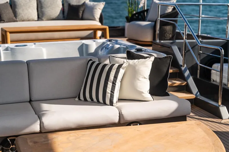 Spectre Yacht Photos Pics Luxurious Azimut 100 Jumbo yacht deck with elegant seating and striped cushions, 2004 model.