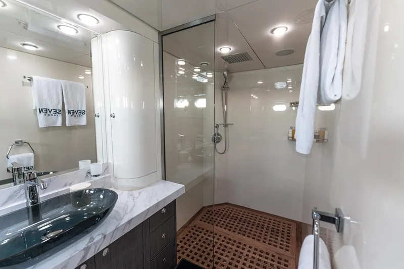 Spectre Yacht Photos Pics Luxurious bathroom on 2004 Azimut 100 Jumbo yacht with modern fixtures and elegant design.