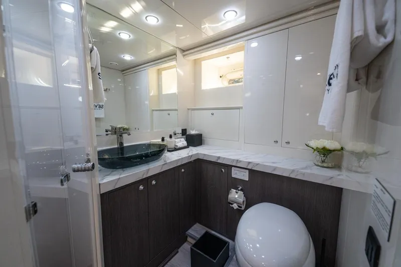 Spectre Yacht Photos Pics Luxurious bathroom in 2004 Azimut 100 Jumbo yacht with modern fixtures and elegant design.