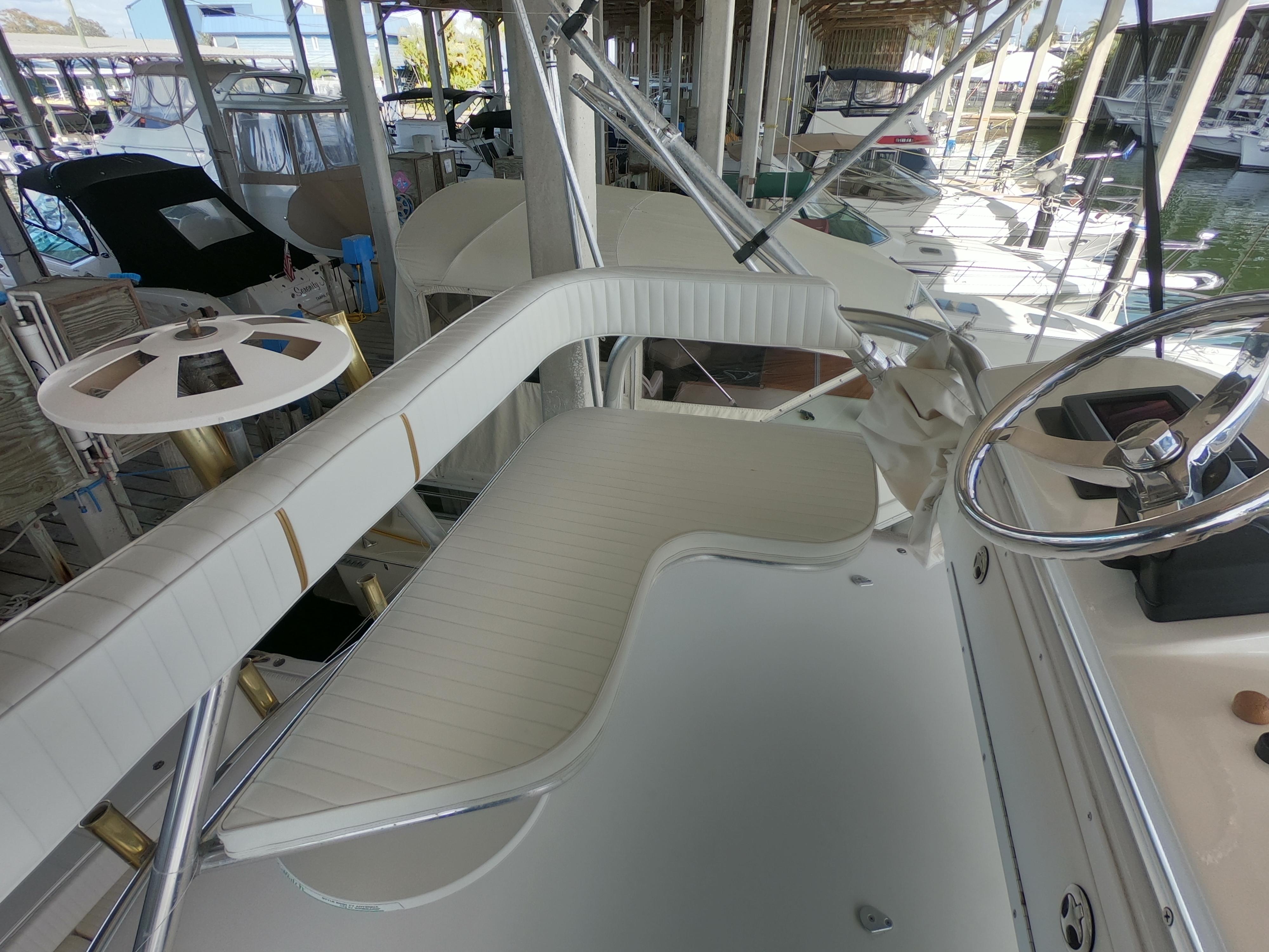 2005 Stamas 370 Express boat interior with white seating and steering wheel.