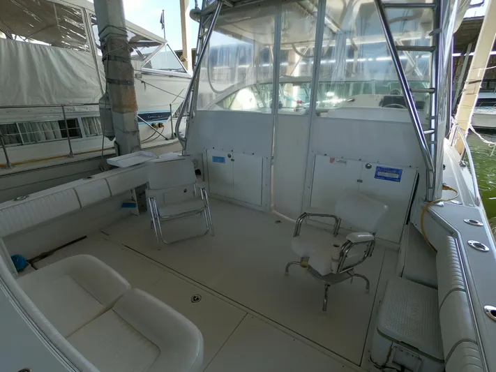  Yacht Photos Pics 2005 Stamas 370 Express boat interior with seating and fishing chairs.