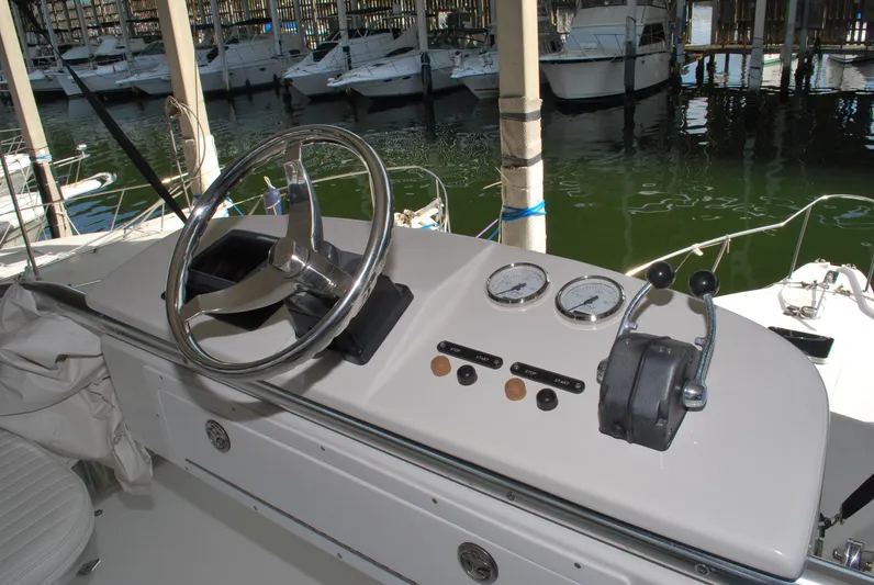  Yacht Photos Pics Helm of 2005 Stamas 370 Express boat with steering wheel and controls.