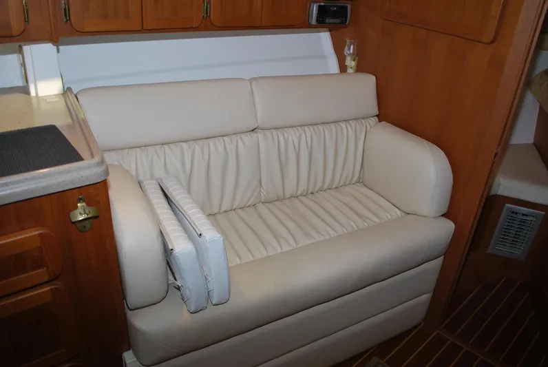  Yacht Photos Pics 2005 Stamas 370 Express interior with beige leather seating and wooden cabinetry.