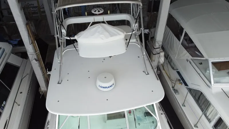  Yacht Photos Pics 2005 Stamas 370 Express boat with radar equipment, docked among other vessels.