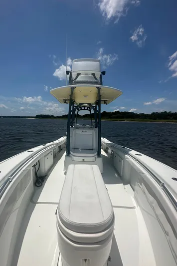  Yacht Photos Pics 2020 Yellowfin 26 Hybrid boat on water under clear blue sky.