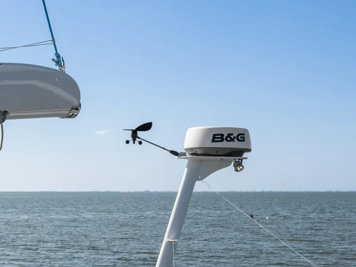Cool Cat Yacht Photos Pics Radar and wind sensor on Technologie Marine Entincelle 60 yacht, 1999, against ocean backdrop.