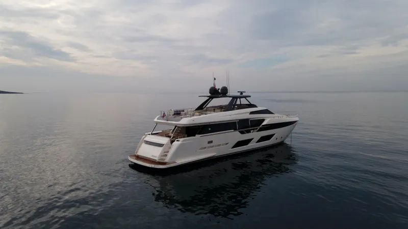 M/y Sunrise Yacht Photos Pics Luxurious 2021 Ferretti Yachts 920 cruising on calm waters under a cloudy sky.