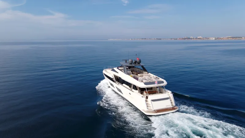 M/y Sunrise Yacht Photos Pics 2021 Ferretti Yachts 920 cruising on open sea under clear blue sky.