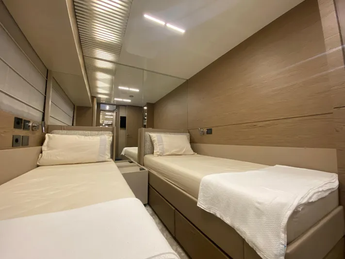 M/y Sunrise Yacht Photos Pics Luxurious twin cabin interior of 2021 Ferretti Yachts 920, featuring modern design and comfortable bedding.