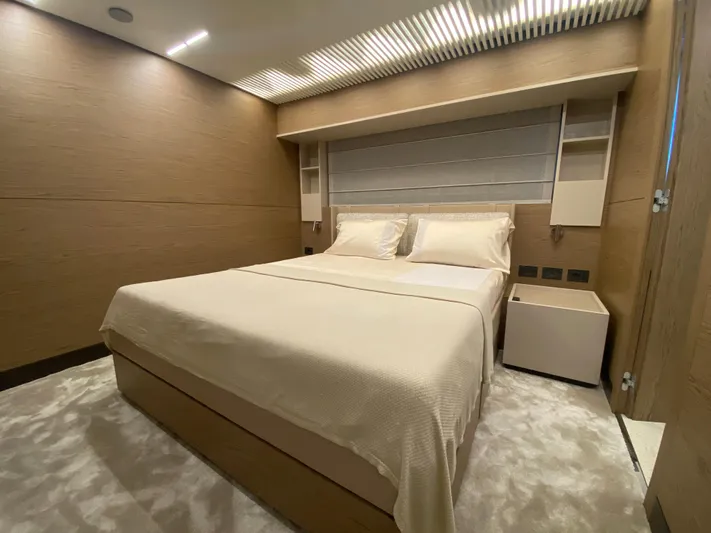 M/y Sunrise Yacht Photos Pics Luxurious bedroom interior of 2021 Ferretti Yachts 920 with modern design and cozy ambiance.