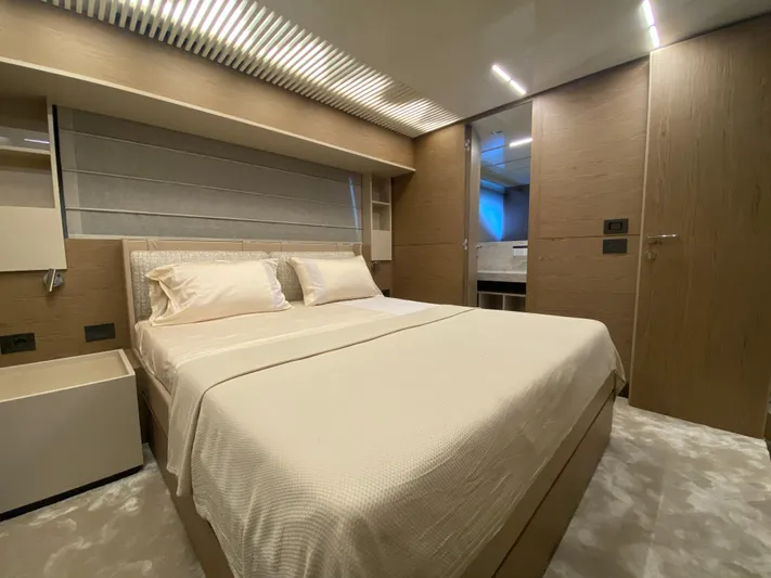 M/y Sunrise Yacht Photos Pics Luxurious bedroom interior of 2021 Ferretti Yachts 920 with modern design and elegant furnishings.