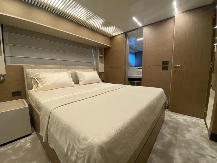 M/y Sunrise Yacht Photos Pics Luxurious bedroom interior of 2021 Ferretti Yachts 920 with modern design and elegant furnishings.