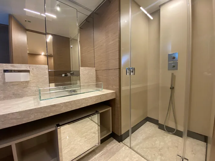 M/y Sunrise Yacht Photos Pics Luxurious bathroom in 2021 Ferretti Yachts 920 with glass shower and modern sink.