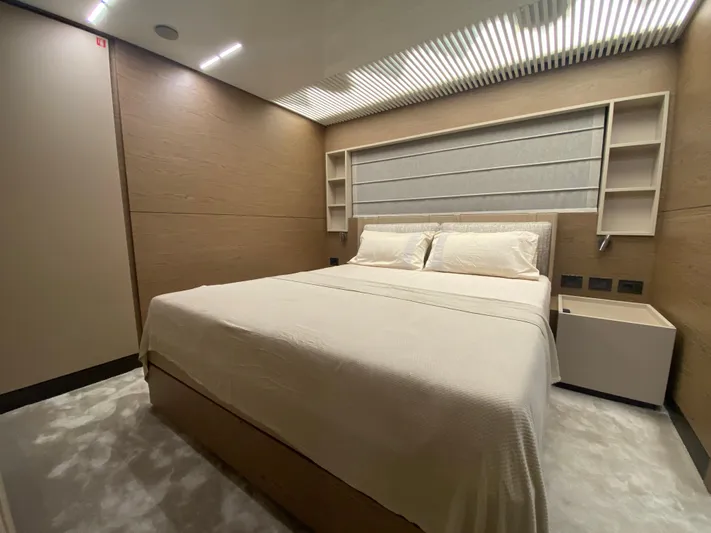 M/y Sunrise Yacht Photos Pics Luxurious bedroom interior of 2021 Ferretti Yachts 920 with modern design and cozy ambiance.