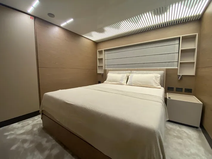 M/y Sunrise Yacht Photos Pics Luxurious bedroom on 2021 Ferretti Yachts 920, featuring modern design and cozy ambiance.