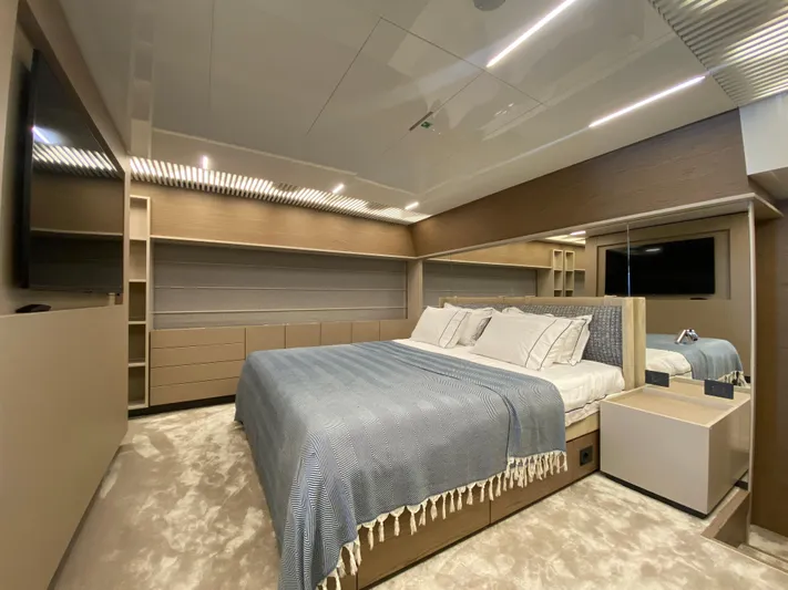 M/y Sunrise Yacht Photos Pics Luxurious bedroom interior of 2021 Ferretti Yachts 920 with modern design and elegant furnishings.