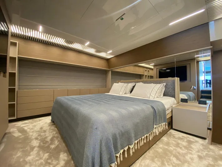 M/y Sunrise Yacht Photos Pics Luxurious bedroom interior of 2021 Ferretti Yachts 920 with modern design and elegant furnishings.