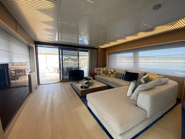 M/y Sunrise Yacht Photos Pics Luxurious interior of 2021 Ferretti Yachts 920 with modern furnishings and large windows.