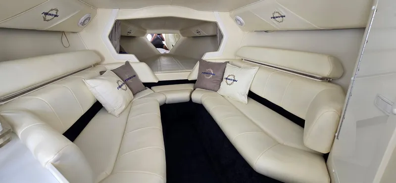  Yacht Photos Pics Luxurious interior of a 2007 Fountain 42 Executioner boat with plush seating and branded cushions.
