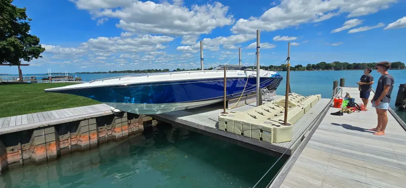  Yacht Photos Pics 2007 Fountain 42 Executioner speedboat docked on a sunny day with clear skies.
