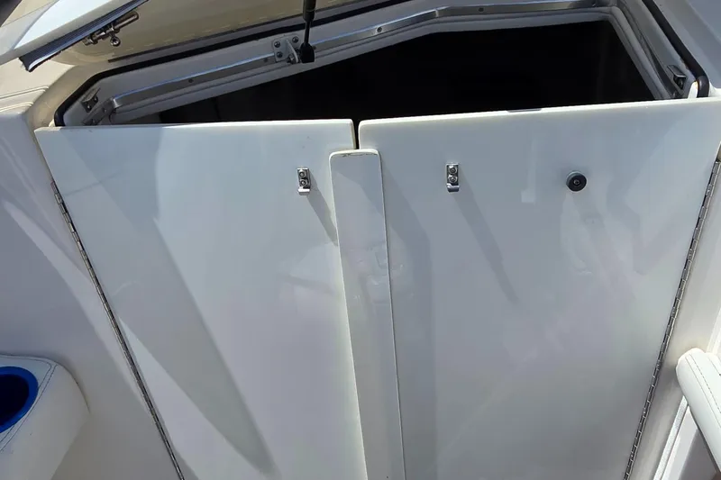  Yacht Photos Pics 2007 Fountain 42 Executioner boat cabin entrance with open hatch and white doors.