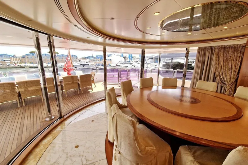  Yacht Photos Pics Luxurious interior of 2010 Benetti Vision 45m yacht with elegant dining area and marina view.