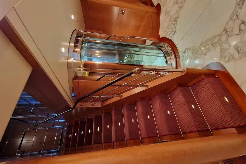  Yacht Photos Pics Luxurious interior staircase and elevator in 2010 Benetti Vision 45m yacht.