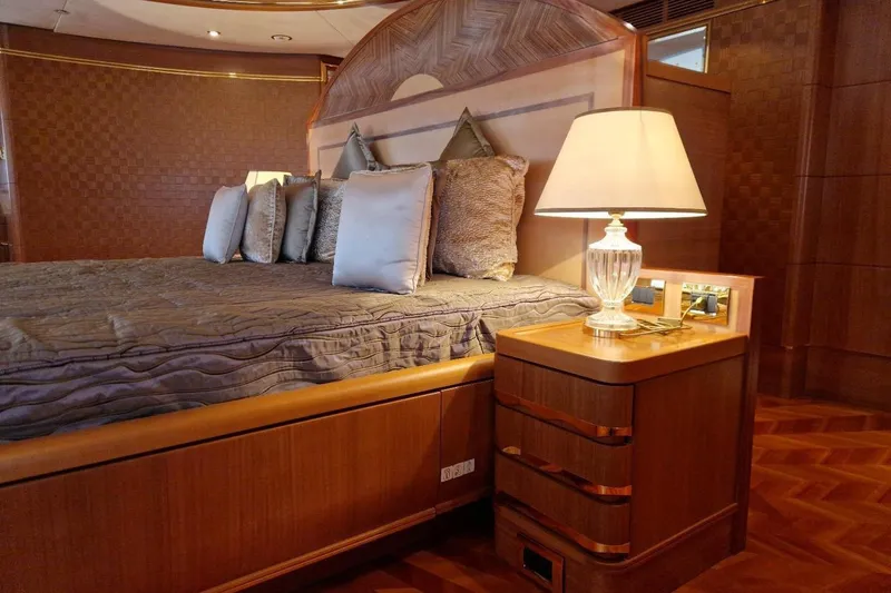  Yacht Photos Pics Luxurious bedroom interior on 2010 Benetti Vision 45m yacht, featuring elegant wood finishes.
