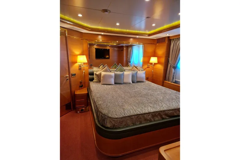  Yacht Photos Pics Luxurious bedroom interior on 2010 Benetti Vision 45m yacht, featuring elegant decor and ambient lighting.