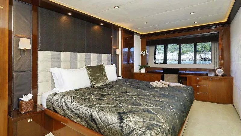 Yacht Photos Pics Luxurious bedroom interior on 2011 Princess V85 yacht with elegant wood finishes.