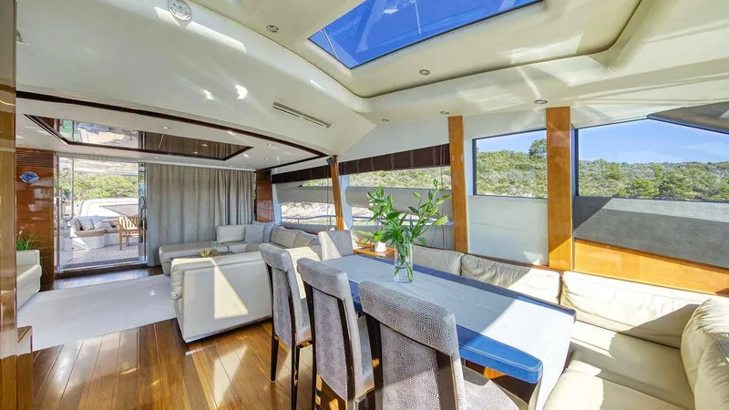  Yacht Photos Pics Luxurious interior of 2011 Princess V85 yacht with elegant dining area and panoramic windows.