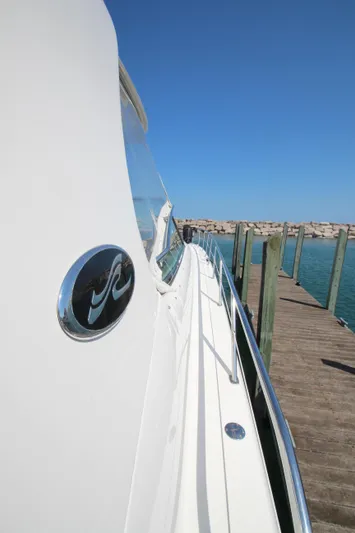  Yacht Photos Pics 2003 Sea Ray 550 Sundancer yacht docked, showcasing sleek design and ocean backdrop.