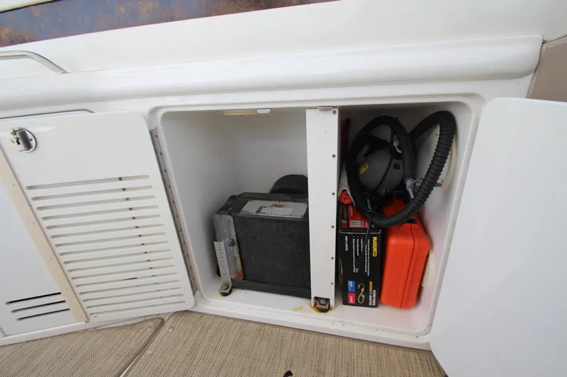  Yacht Photos Pics 2003 Sea Ray 550 Sundancer storage compartment with equipment and tools.