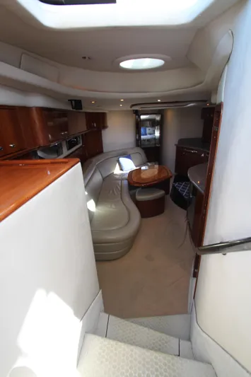  Yacht Photos Pics Interior of 2003 Sea Ray 550 Sundancer yacht with elegant seating and wooden cabinetry.
