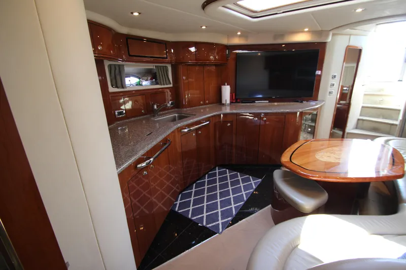  Yacht Photos Pics Luxurious interior of 2003 Sea Ray 550 Sundancer yacht with elegant wood cabinetry.