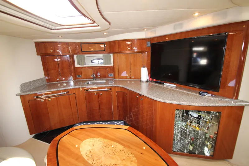  Yacht Photos Pics Luxurious 2003 Sea Ray 550 Sundancer yacht interior with modern kitchen and entertainment area.